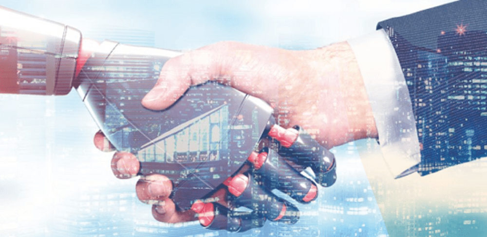 A human hand shaking hands with a robotic hand, symbolizing collaboration between humans and technology.